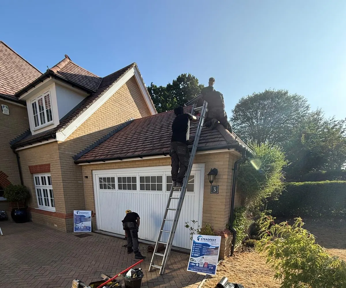 The Steadfast team at work on a scaffolded roof in Kent